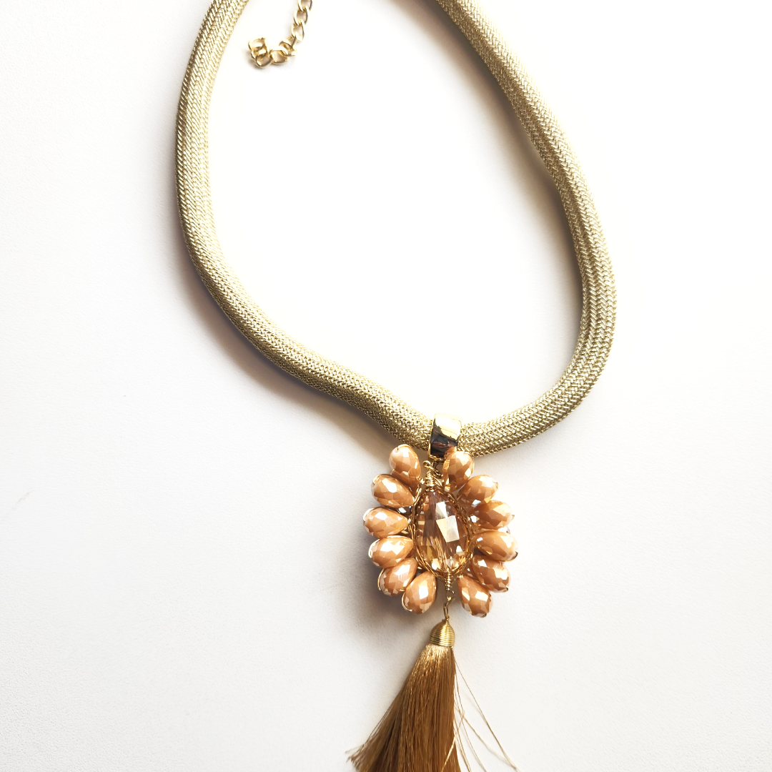 Crafted pink beaded and elastic necklace with a beaded pearls and a beautiful gold Tassel