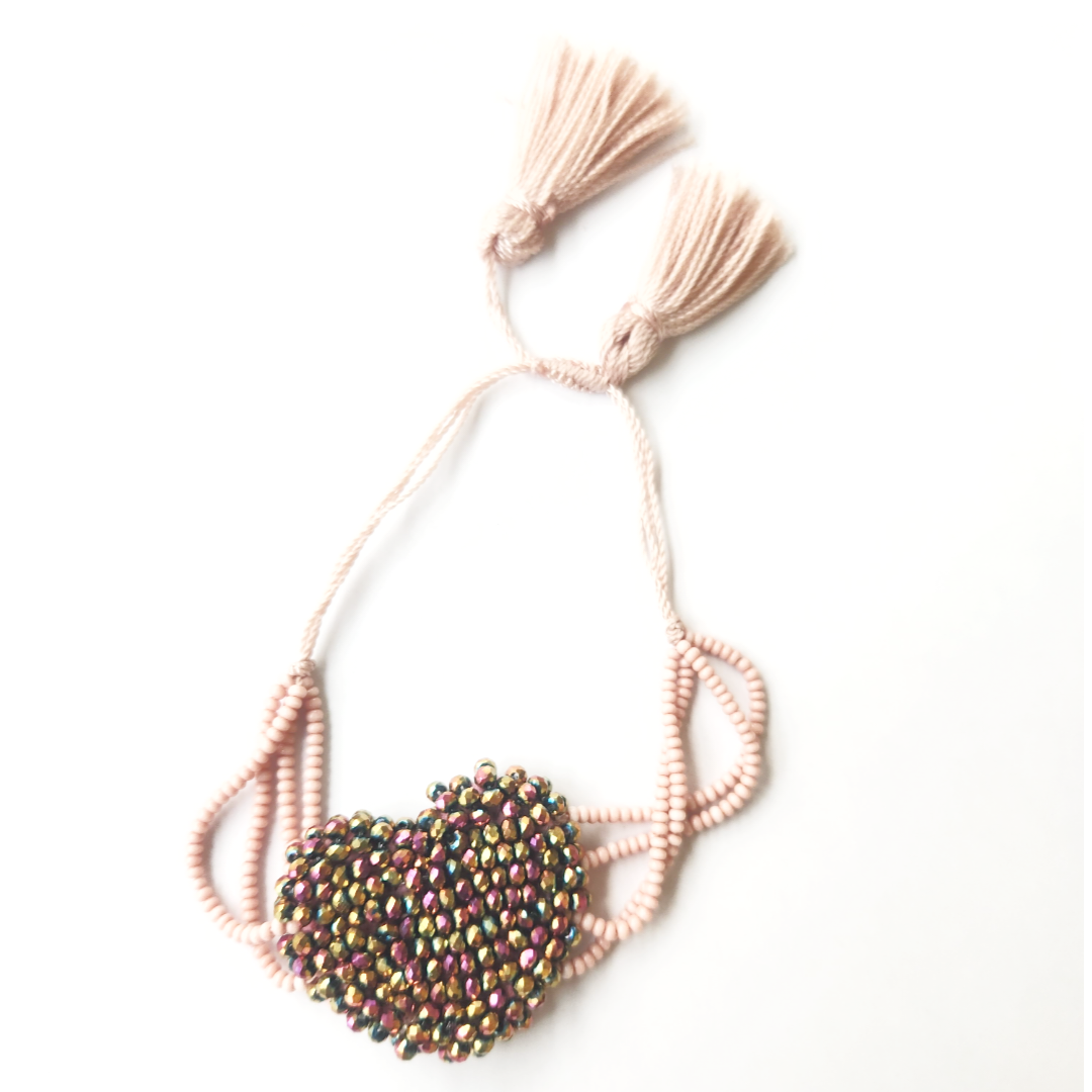 Bracelet heart shaped with pink braided hemp thread