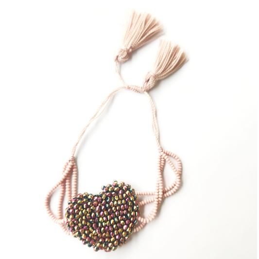 Bracelet heart shaped with pink braided hemp thread